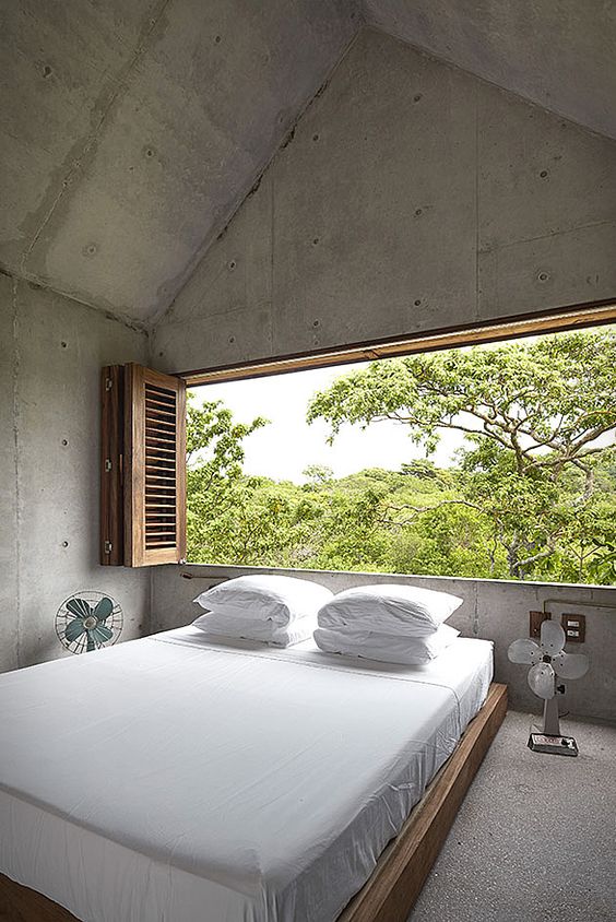 clean and spacious bedroom with natural backdrop