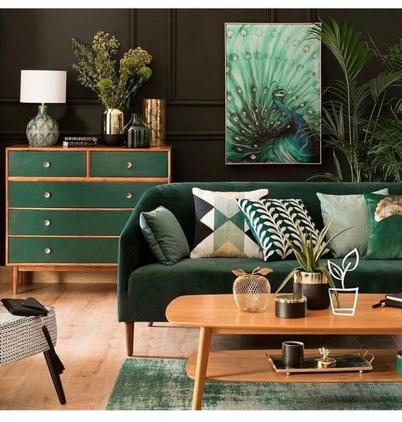 Dark green wall and peacock painting for tropical living room ideas