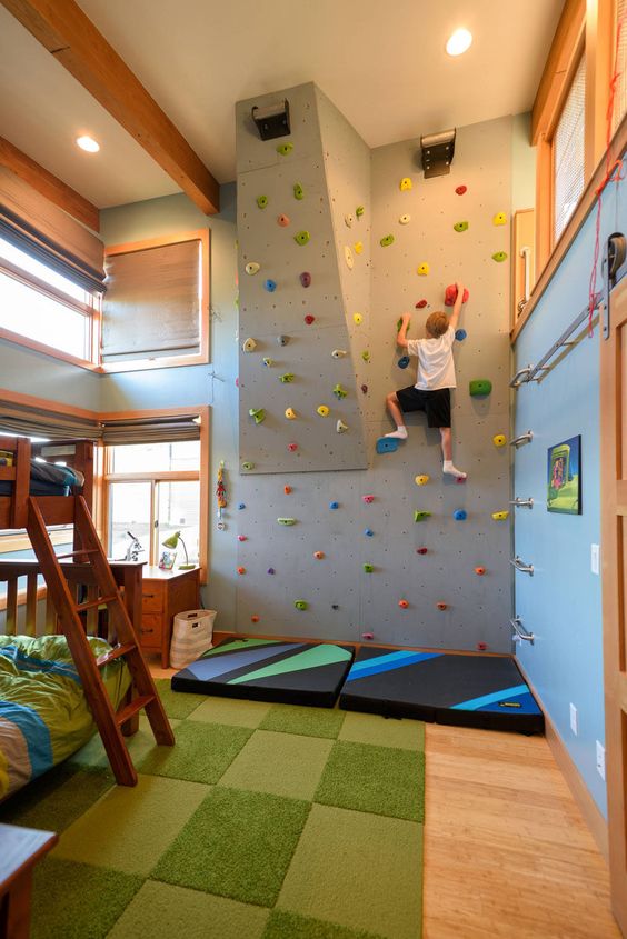 adventurous bedroom with rock climbing wall for kids