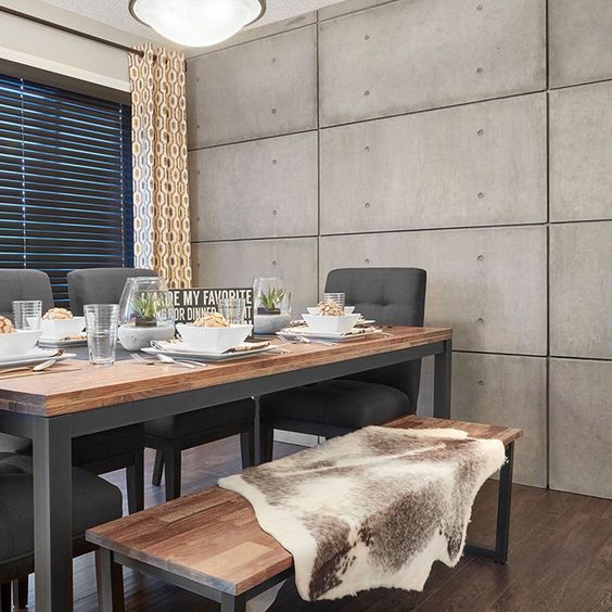 stylish dining area with concrete wall panel