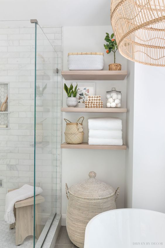 unique bathroom with wooden floating shelf