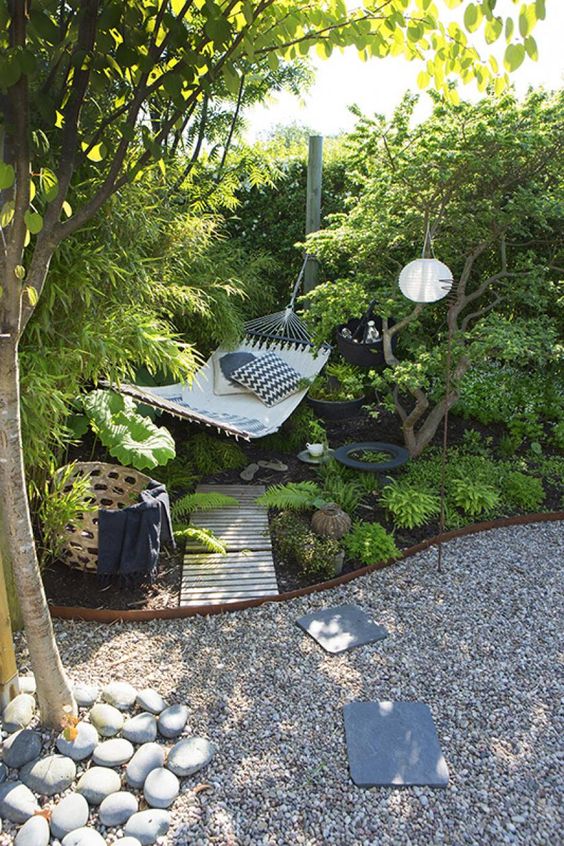 cozy outdoor reading nook by installing hammock in the backyard