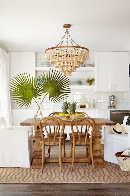 wooden dining table and chairs in tropical kitchen decor