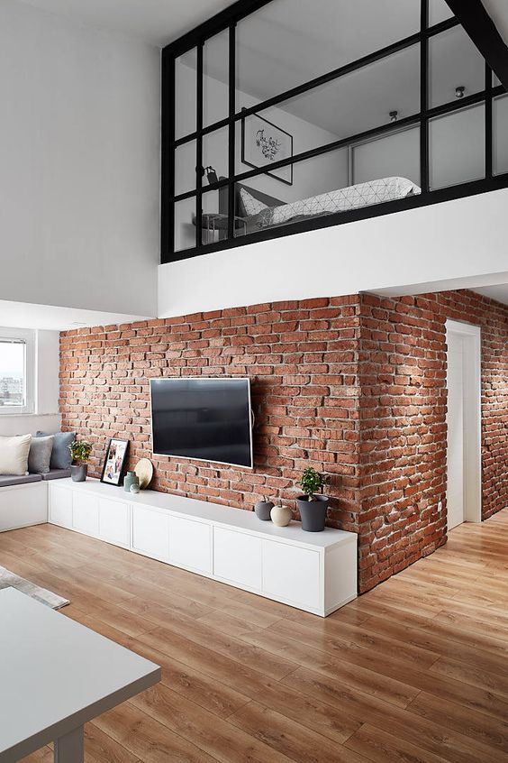 exposed brick wall create a focal point to the interior