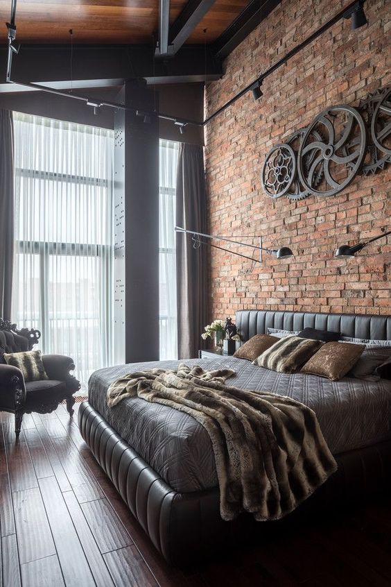 the industrial bedroom with brick wall accent