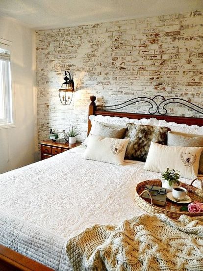 rustic bedroom with brick wall