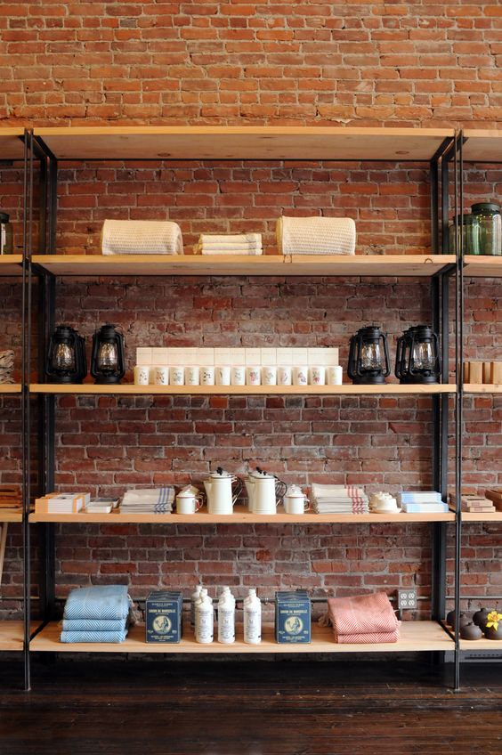 clutter-free wooden shelves for brick interior
