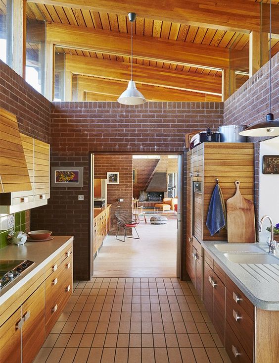 wooden cabinetry for the brick kitchen style